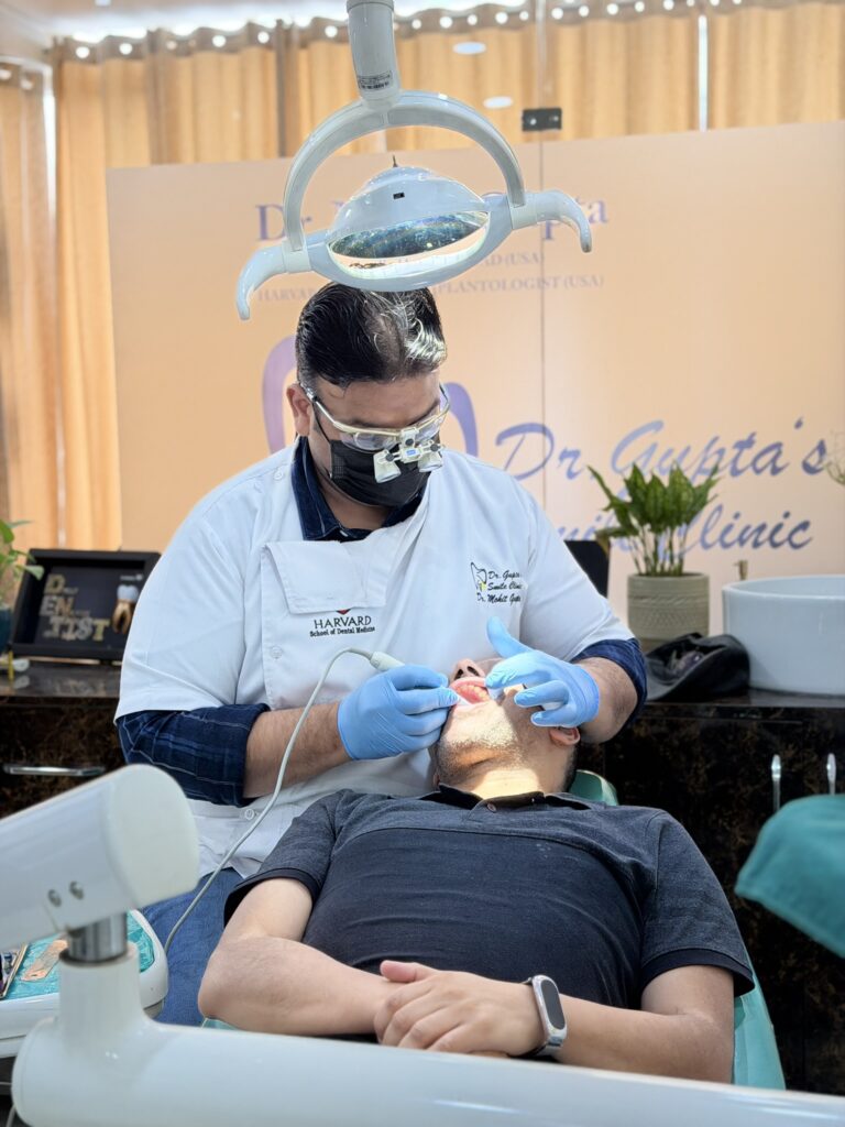 Dr. Mohit Gupta treating a patient at his dental clinic in Zirakpur
