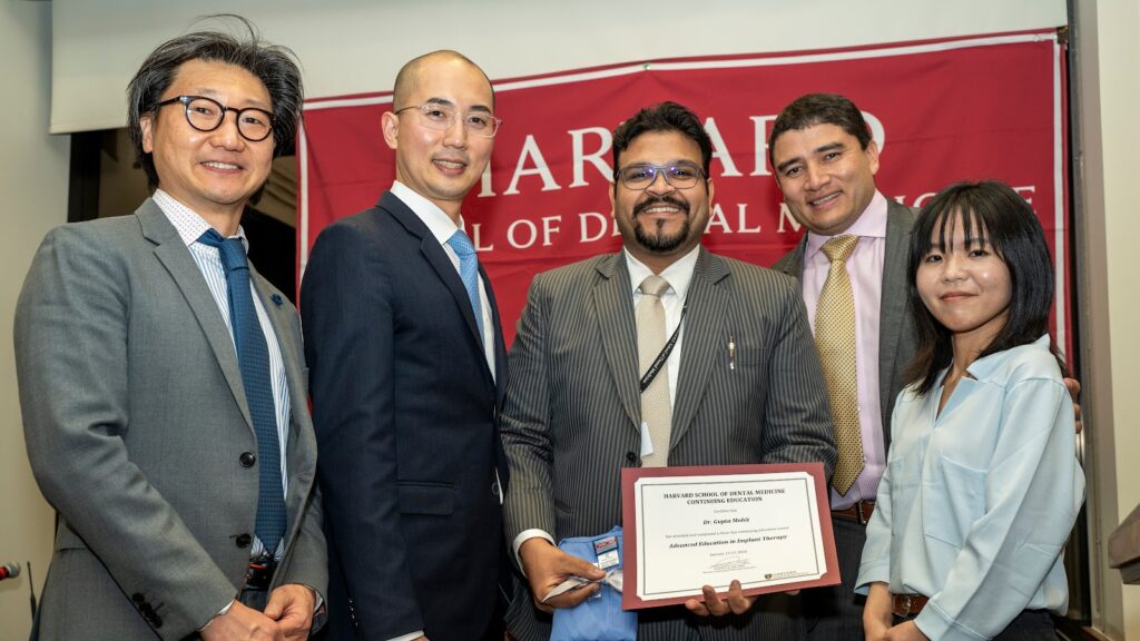Dr. Mohit Gupta receiving a certificate at Harvard School of Dental Medicine