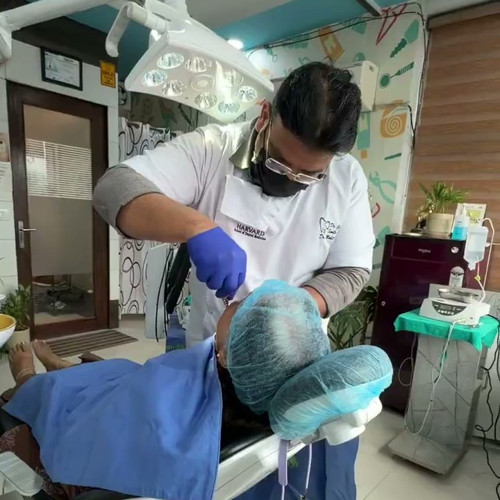 Dr. Mohit Gupta performing oral surgery at his Zirakpur clinic