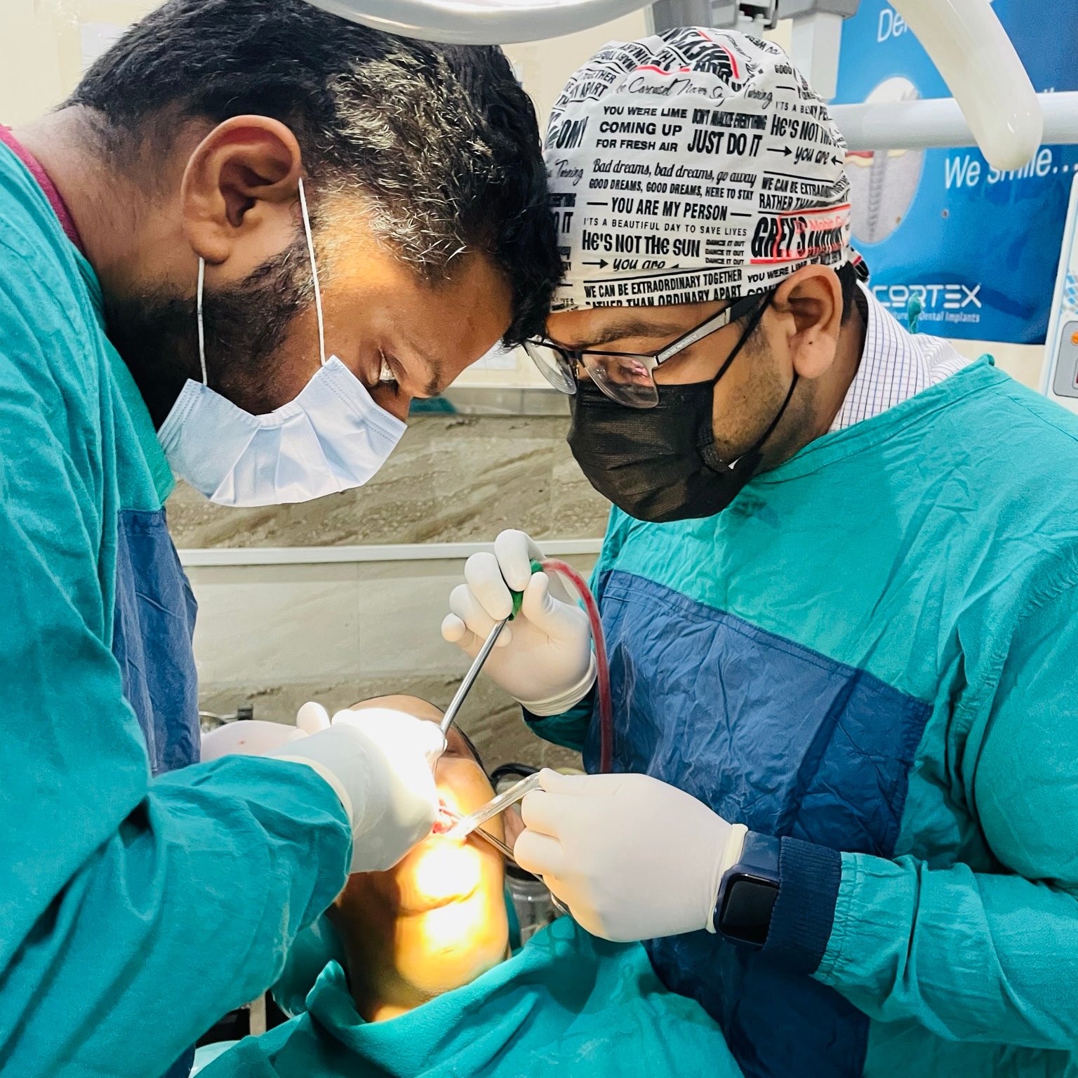 Dr. Mohit Gupta performing a tooth extraction at Dr. Gupta's Smile Clinic, Zirakpur